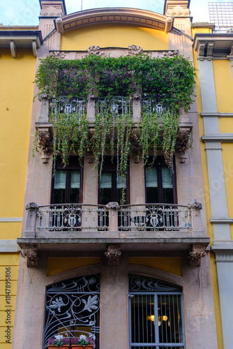 Old residential buildings along Via dei Praga in Milan, Italy