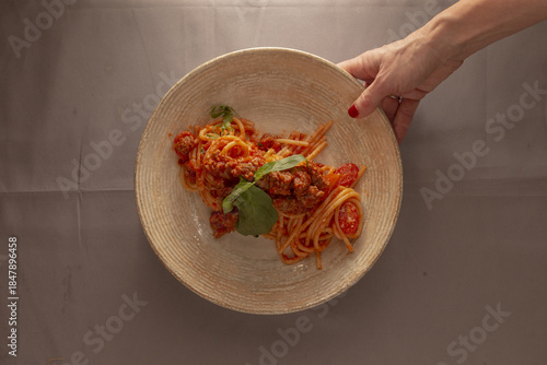 Delicious comforting meal, Enjoy cozy plate of lovingly prepared traditional spaghetti with rich tomato sauce, Savor comforting dish of classic homemade pasta topped with savory tomato base
