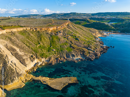 Drone view of Ghain Tuffieha beach. Mediterranean sea, rocks, hills