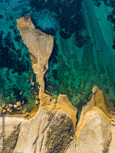 Drone top view of Ghain Tuffieha. Mediterranean sea, rocks, hills. Malta 