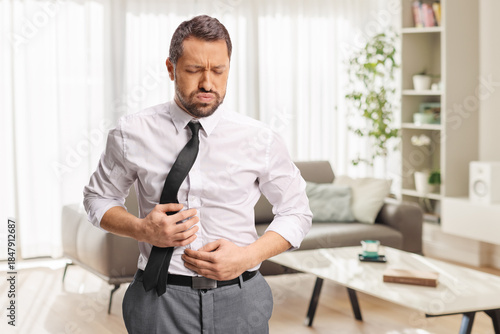 Tableau sur toile Manwith stomach ache feeling bloated