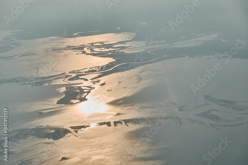 Aerial view of Venice Italy featuring the historic city center and winding canals surrounded by the blue waters of the Venetian Lagoon