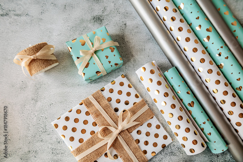Wallpaper Mural Flat lay of stylish gift boxes with golden hearts and polka dots, rustic ribbons and decorative wrapping rolls. Cozy handmade holiday scene Torontodigital.ca