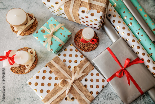 Wallpaper Mural Festive flat lay with gifts and decorative candles on straw coasters. Handmade wrapping and cozy rustic aesthetic for winter celebrations Torontodigital.ca