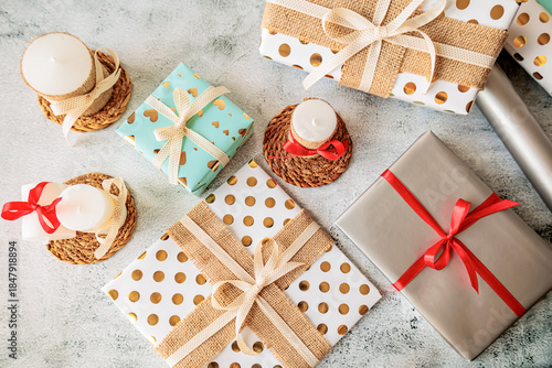 Wallpaper Mural Decorative scene with gift boxes, ribboned candles and wrapping paper. Aesthetic and warm composition for seasonal celebrations Torontodigital.ca