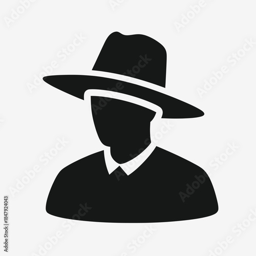 Silhouette of a person wearing a hat