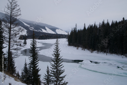 Open water on a snowy river in winter