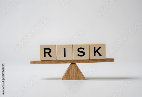 Balancing Risk Concept with Wooden Blocks on a Simple Scale