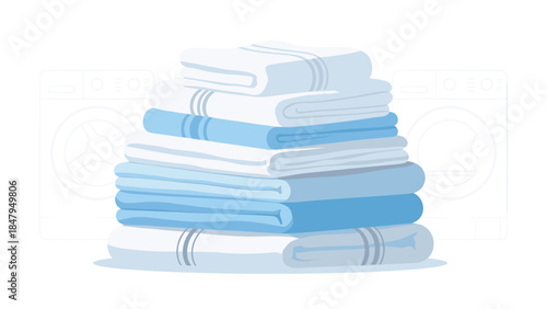 A neatly folded stack of fresh, clean towels sits between two washing machines, representing laundry day and household chores.