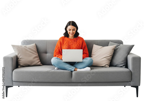 Smiling Woman in Orange Sweater Using Laptop While Sitting on Grey Sofa