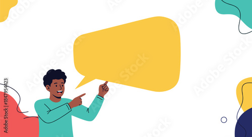 Happy young man points towards a large yellow speech bubble providing blank copy space for your message or announcement.