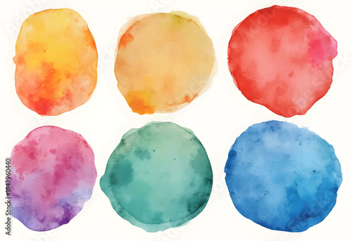 Bright and colorful circles created with watercolor techniques display an array of hues including yellow, red, pink, green, and blue. This artistic composition generates visual interest and vibrancy.
