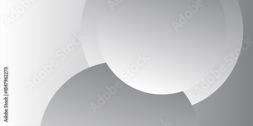 A minimalist abstract background featuring overlapping curves and circular shapes in various shades of gray, creating a smooth gradient and subtle depth
