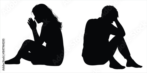 Silhouettes of a Sad Woman and a Distressed Man Sitting Down Keywords: silhouette, woman, man, sitting, sad, distressed, despair