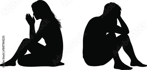 Silhouettes of a Woman and Man Sitting in Sad or Contemplative Poses Keywords: silhouette, sitting, woman, man, sad