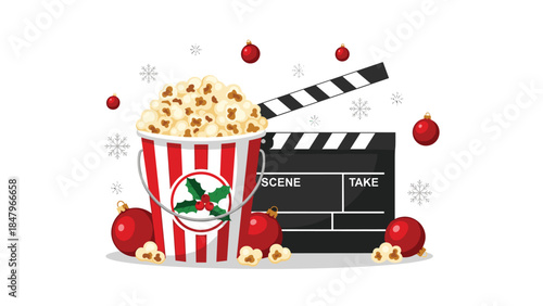 Festive movie night setup with popcorn, ornaments, and a clapperboard creates a cozy and joyful holiday atmosphere.