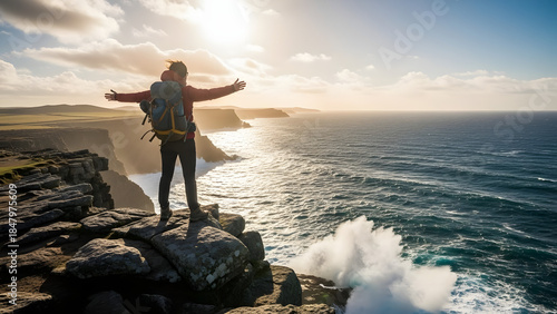 Solo adventurer celebrates personal triumph and freedom, standing on a breathtaking coastal cliff overlooking the vast, sunlit ocean with outstretched arms