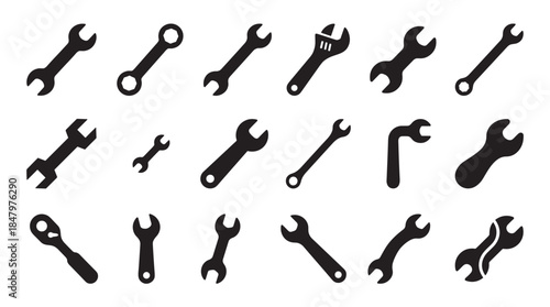 Large collection of black wrench icons featuring various types of spanners and ratchets in a simple, flat graphic style for mechanical and repair concepts