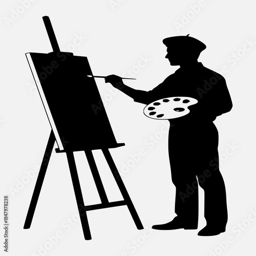 A silhouette of an artist creating a masterpiece on an easel standing in a studio