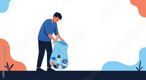 A responsible young man is collecting trash and litter into a large bag, helping to clean up the environment and the park.