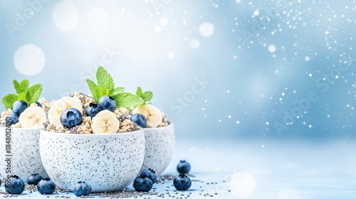 Wallpaper Mural Delicious Breakfast Bowls: Freshly prepared bowls of granola, adorned with vibrant blueberries and banana slices, presented on a calming, blurred backdrop, ready to start the day. Torontodigital.ca