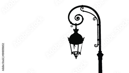 Silhouette of an ornate vintage street lamp 