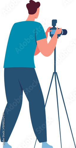 Man holding a camera on a tripod, capturing footage or images