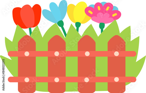 Colorful spring flowers growing behind a wooden fence