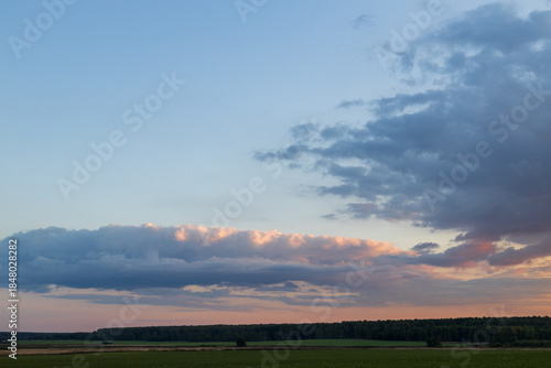 A beautiful sky with a few clouds and a sunset