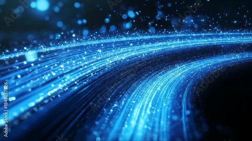 Glowing blue light trails curve through a dark space with bokeh effect creating a futuristic abstract background with streaks of light and particles 4k video