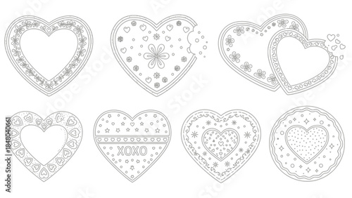 Set of intricately decorated heart-shaped cookies featuring floral and whimsical patterns for