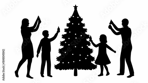 Family decorating Christmas tree together in silhouette