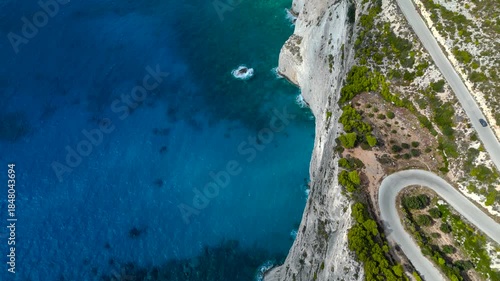 4K Cinematic Drone Footage of Cliffside Road in Zakynthos, Greece, Curving Above Turquoise Ionian Sea and Limestone Coastline