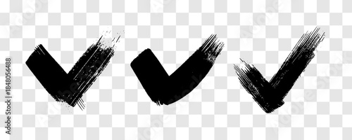 Set of black grunge brushstrokes in the shape of a check mark