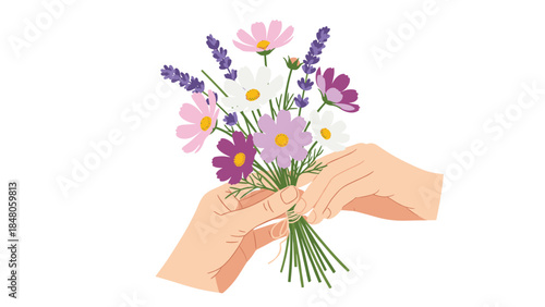 Hands gently tie a colorful bouquet of wildflowers with stems gathered together, creating a beautiful floral arrangement.