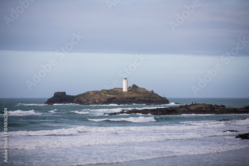 Godrevy Lighthouse at Godrevy Beach in Cornwall, UK.