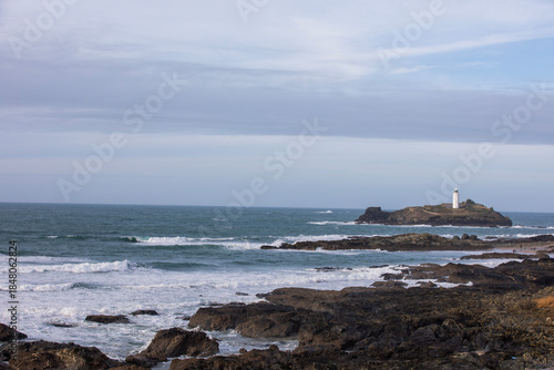 Godrevy Lighthouse at Godrevy Beach in Cornwall, UK.