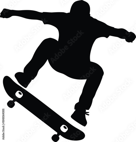 Silhouette of skateboarder performing trick in mid-air