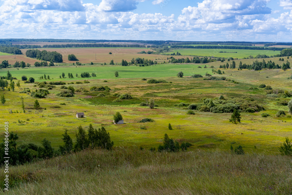 Fototapeta premium Hills with meadows and forests.