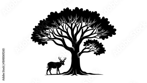 Majestic silhouette of a stag standing peacefully under a large, detailed tree.