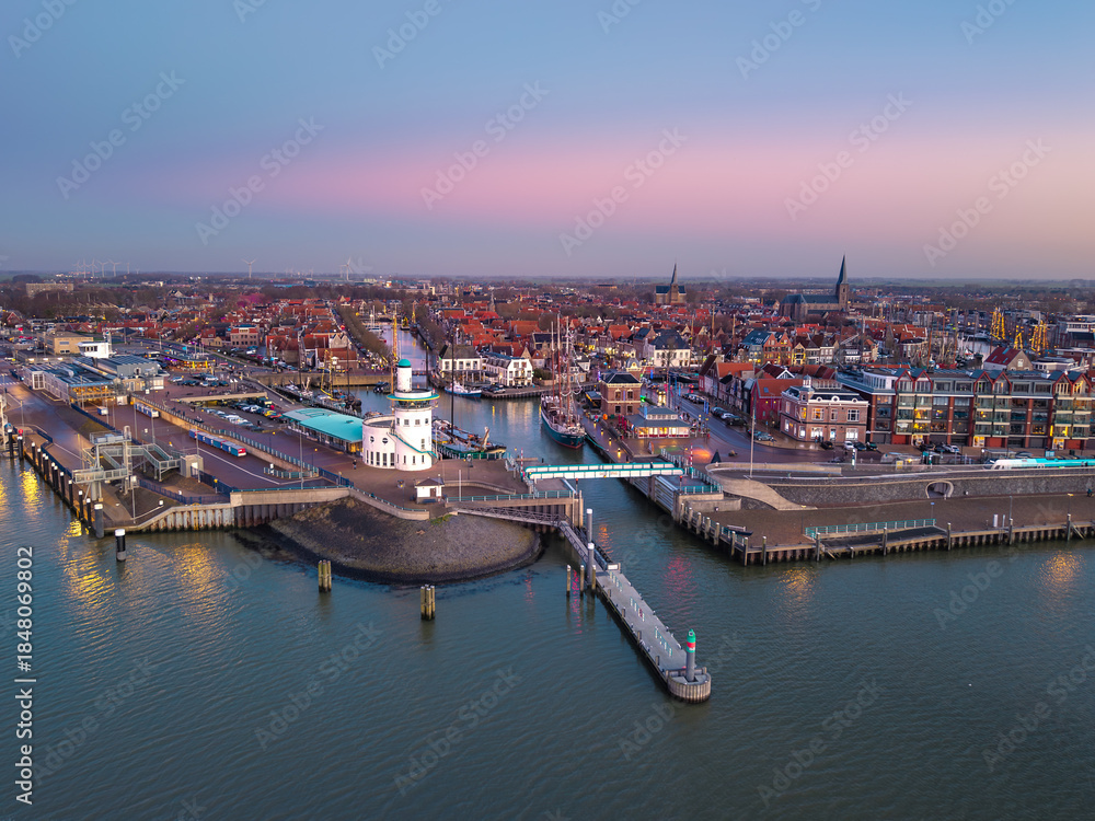 Fototapeta premium Aerial drone view of Harlingen ferry terminal at dusk