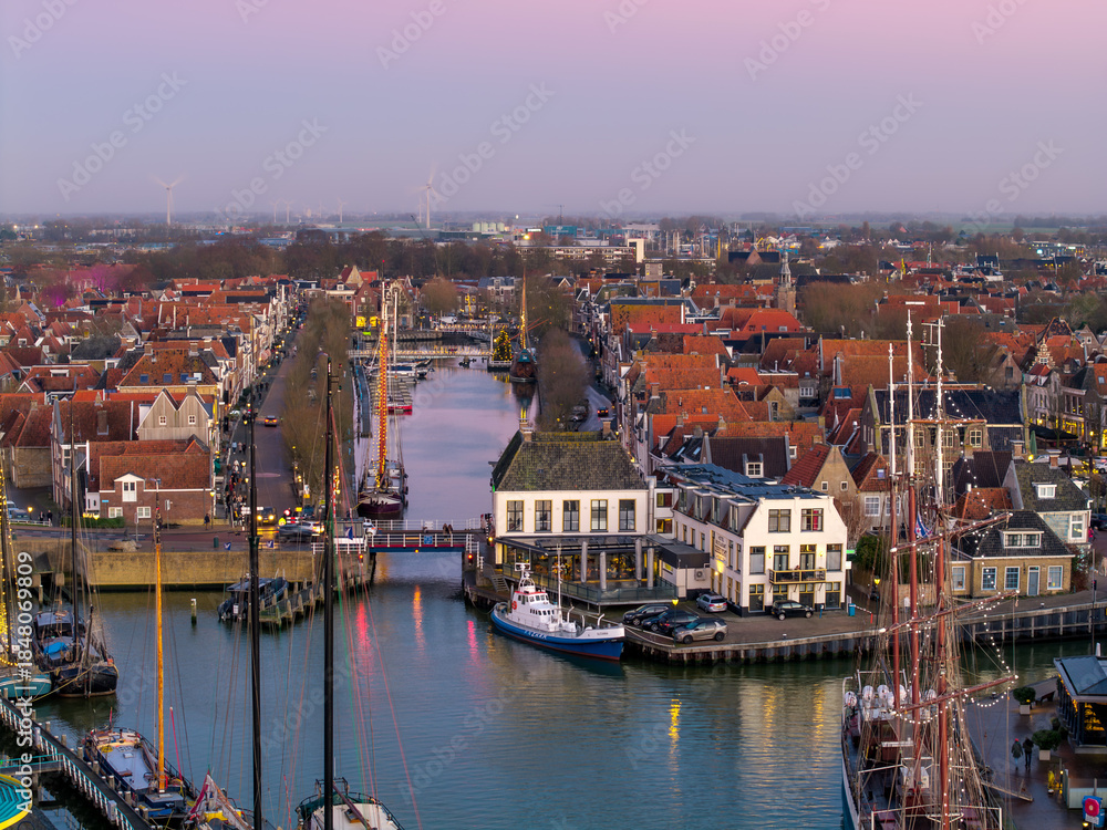 Fototapeta premium Aerial drone view of Harlingen harbour at sunset