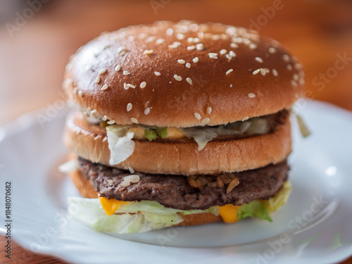 Juicy Beef Burger with Fresh Vegetables and Sesame Bun