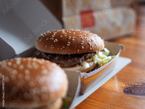 Delicious Beef Hamburger with Fresh Ingredients on Table