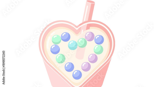 Whimsical heart-shaped beverage with colorful round candy embellishments and a playful straw