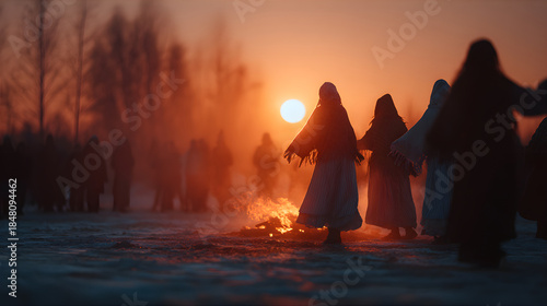 Woman dancing around fire ritual during winter solstice. Pagan celebration with women in traditional clothes. Ceremony for spirituality concept.