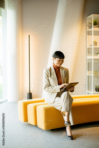 Businesswoman using tablet ...
