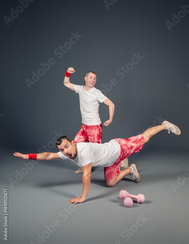 Two funny active men are training balance, strength and coordination