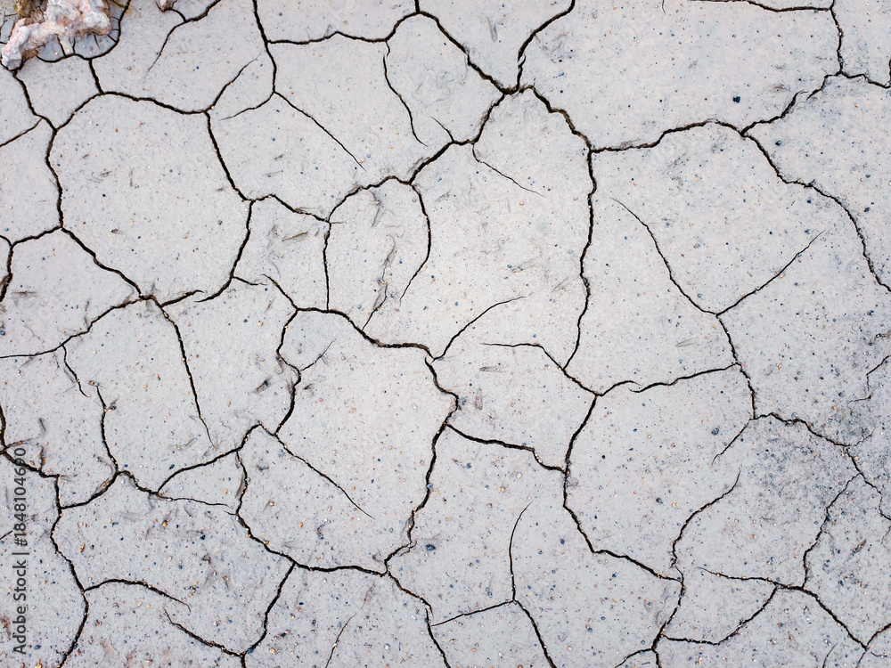 Obraz premium Cracked earth background, the image shows a texture with a pattern of cracks in the dried soil