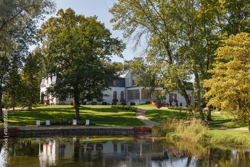 Neeruti Manor park landscape with water reflection Estonia